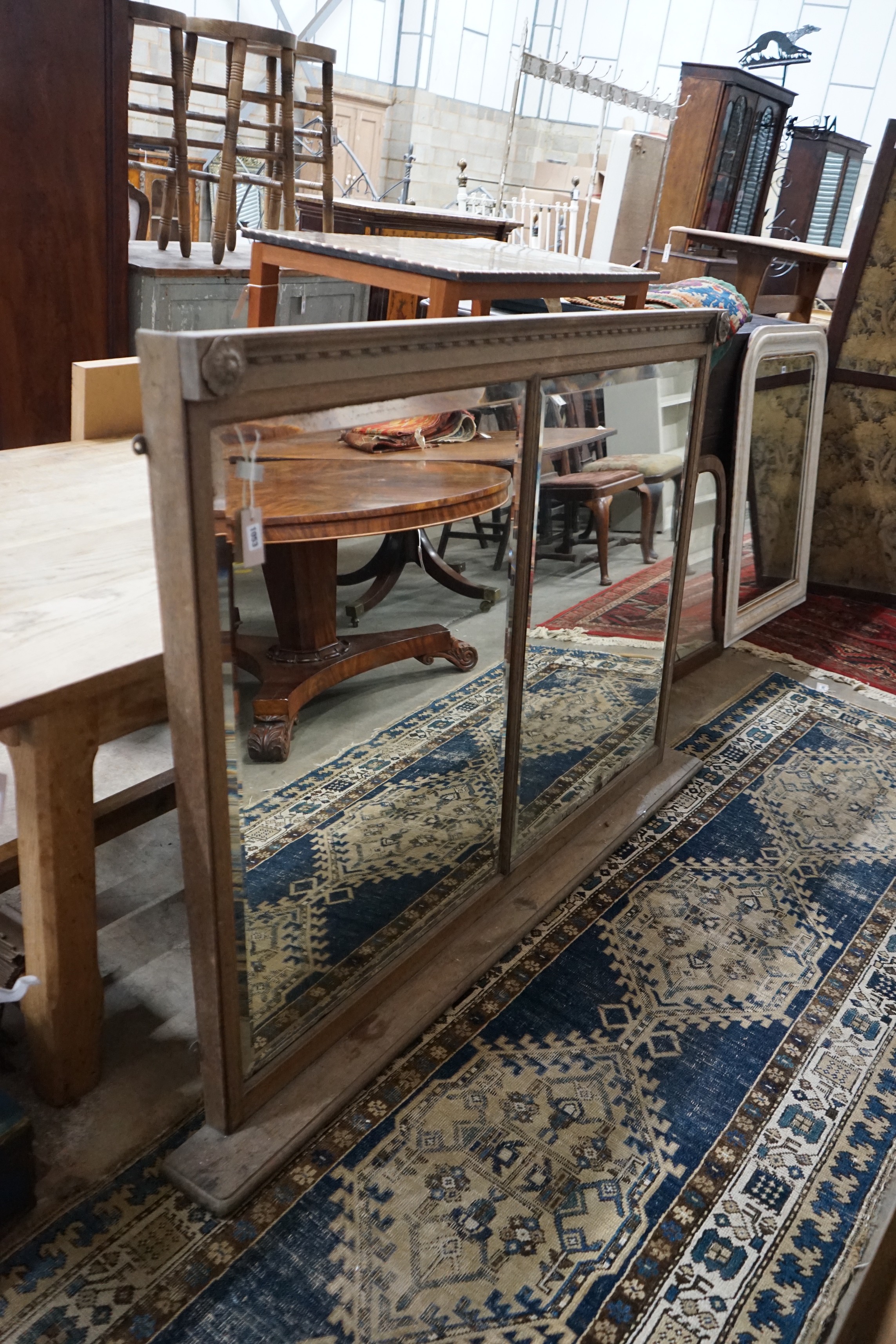 An early 20th century oak framed twin plate overmantel mirror, width 157cm, height 115cm